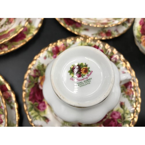 27 - A selection of Royal Albert Country Roses to include cake plate 26cms d, 12 plates 21cms d, 6 side p... 