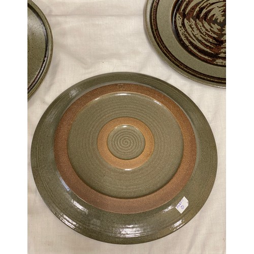 31 - A collection of 6 David Lloyd Jones studio pottery dinner plates 29.5cms d with brown circular swirl... 