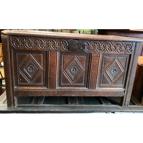 1275 - An 18thC oak panelled chest with candle box to interior. 109cms w x 51cms d x 62cms h.