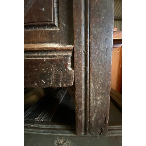 1275 - An 18thC oak panelled chest with candle box to interior. 109cms w x 51cms d x 62cms h.