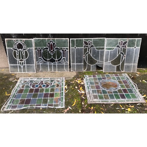 159 - Six coloured leaded glass window panels, largest multicoloured panel 78 x 72cms, one with painted mo... 