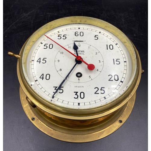 675 - A Smiths Astral Brass Ship's Clock with minutes outside  and hours inside. Serial number AP160174. D... 