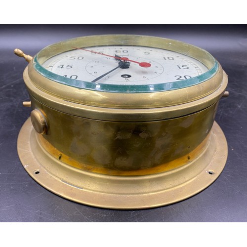 675 - A Smiths Astral Brass Ship's Clock with minutes outside  and hours inside. Serial number AP160174. D... 