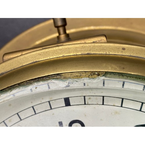 675 - A Smiths Astral Brass Ship's Clock with minutes outside  and hours inside. Serial number AP160174. D... 