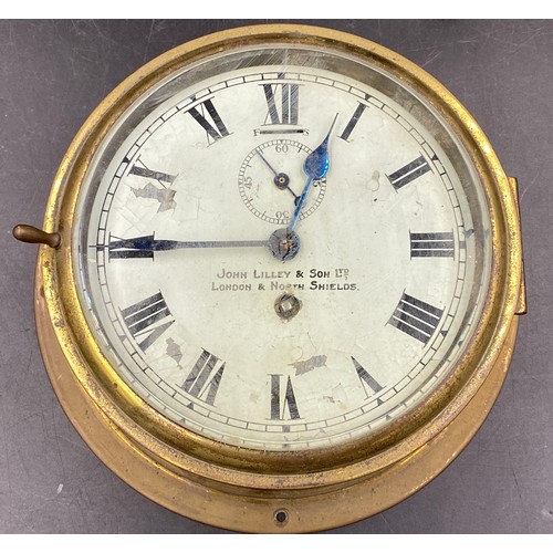 676 - A John Lilley & Son Ltd, London & North Shields brass ships clock with enamel face and Roman numeral... 