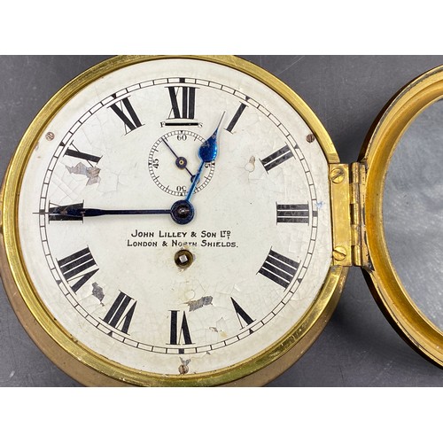 676 - A John Lilley & Son Ltd, London & North Shields brass ships clock with enamel face and Roman numeral... 