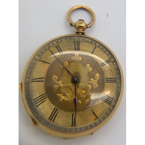 639 - An 18ct gold cased pocket watch with floral decorated face and winding key. 3.5cms d, total weight 3... 