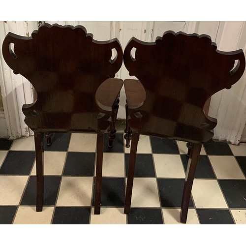 1282 - A pair of 19thC mahogany hall chairs.