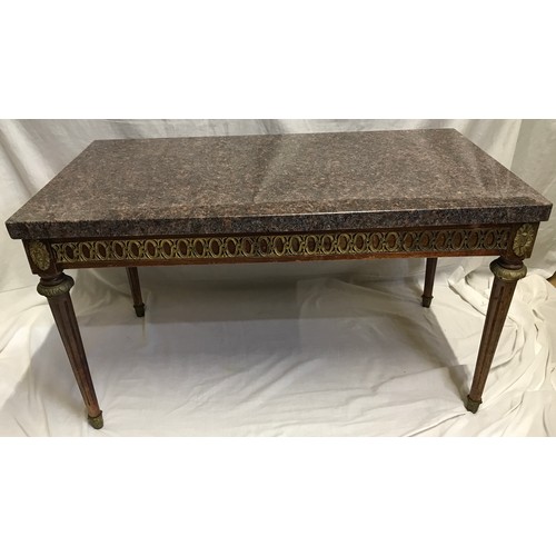 1283 - A granite topped side table with decorative brass to sides and Corinthian column legs. 90cms w x 50c... 