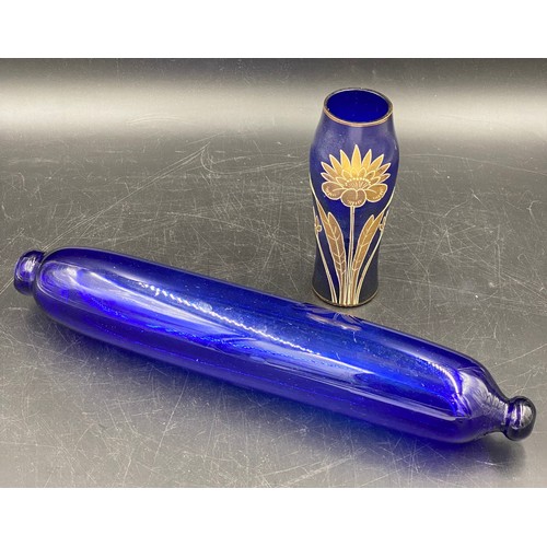 164 - A 19thC Bristol blue glass rolling pin 37cms l together with a blue and gilt vase 16cms h.