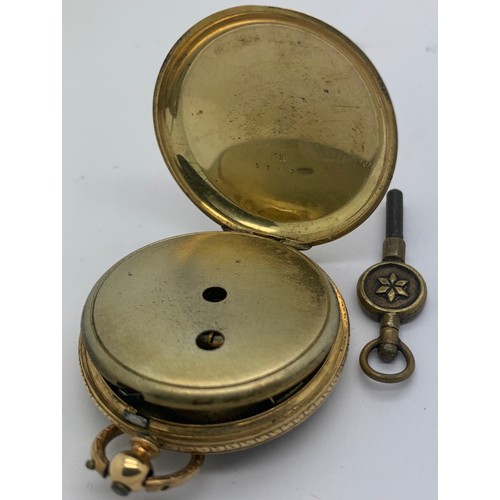 640 - A 19thC 18ct gold cased pocket watch and key. 3.5cms d. Weight 32gms.