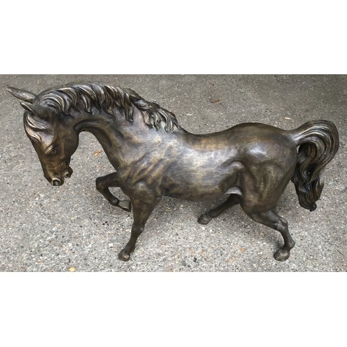 1321 - Large bronze effect figurine of a prancing horse. 69 h x 80cms l.