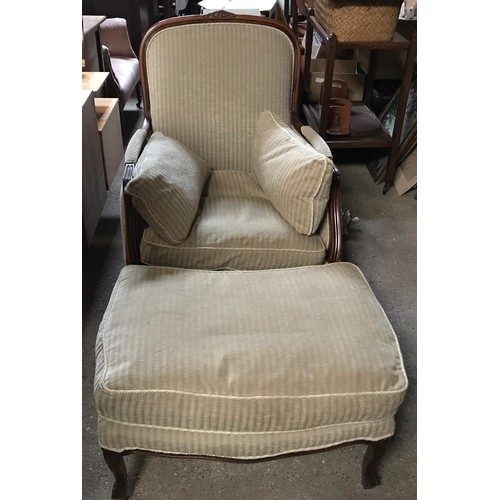 1301 - A carved wooden framed upholstered armchair, Rssini chair, Grecoceladon with matching footstool, cha... 