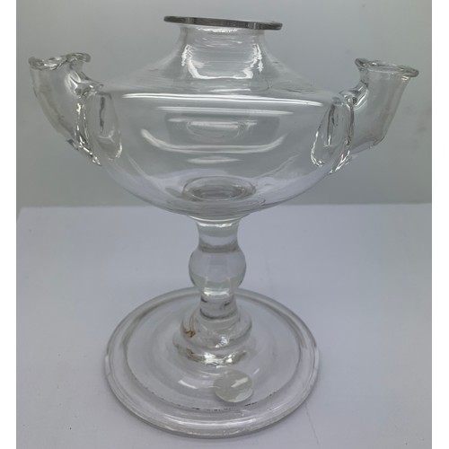 544 - A rare double spout baluster oil lamp. The oval body with a top filling turned neck and spout either... 