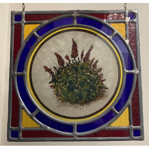 151 - A pair of well made leaded glass window panels, both with centre panels of flowers in multi colours.... 