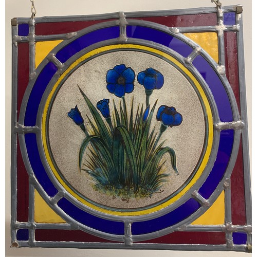 151 - A pair of well made leaded glass window panels, both with centre panels of flowers in multi colours.... 