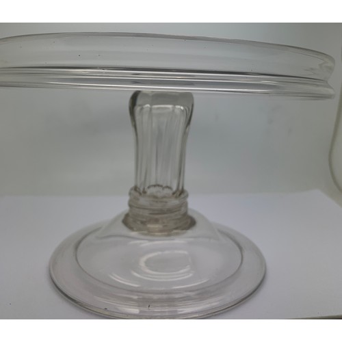 155 - A Georgian glass tazza with a circular galleried top, a generously moulded and collared stem and a d... 