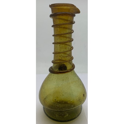 156 - An olive green long neck glass jug with a spiral of green glass rising up the neck to the pourer spo... 