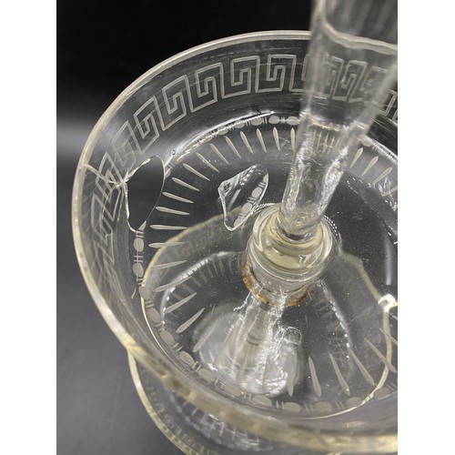 148 - An early 19thC glass sweetmeat dish with trumpet vase to top and Greek key engraving. 39cm h.