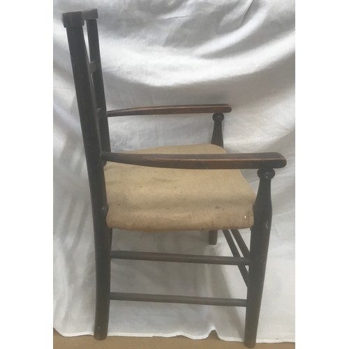 1306 - A beechwood framed child's slat back armchair. Height to seat 31cm, to back 65cm, width 39cm.