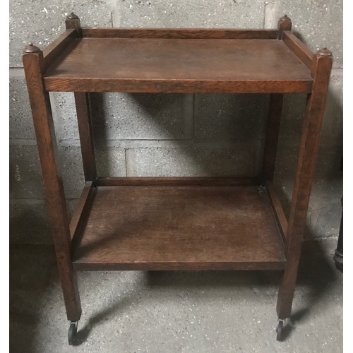 1310 - An oak two tier serving trolley 66cm w x 44cm d x 87cm h.