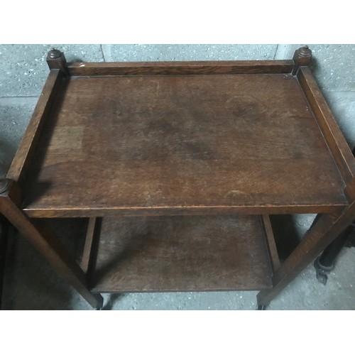 1310 - An oak two tier serving trolley 66cm w x 44cm d x 87cm h.