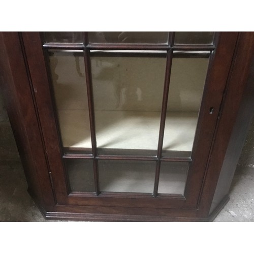 1311 - A mahogany wall mounted display cabinet with panel glass single door. 78cm w x 32cmd x 82cm h.