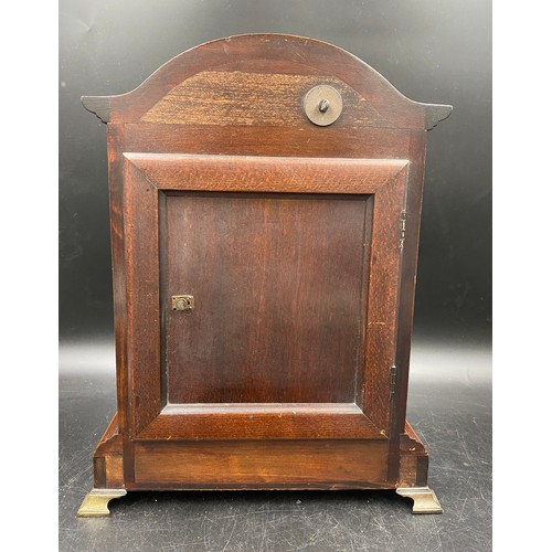 673 - A mahogany cased mantle clock with German movement by Junghans Wurttemberg and Westminster charm. Pe... 