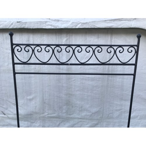 1287 - A wrought metal clothes hanging stand 75cms w x 171cms h x 36cms d.