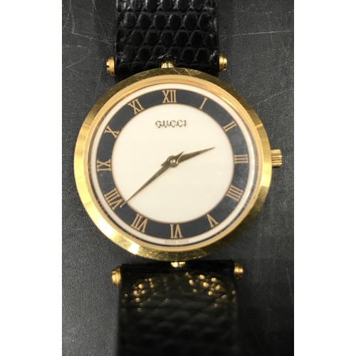 636 - A Gentleman's Gucci gold plated wristwatch with Roman numeral face and leather strap. Case size 3.5c... 