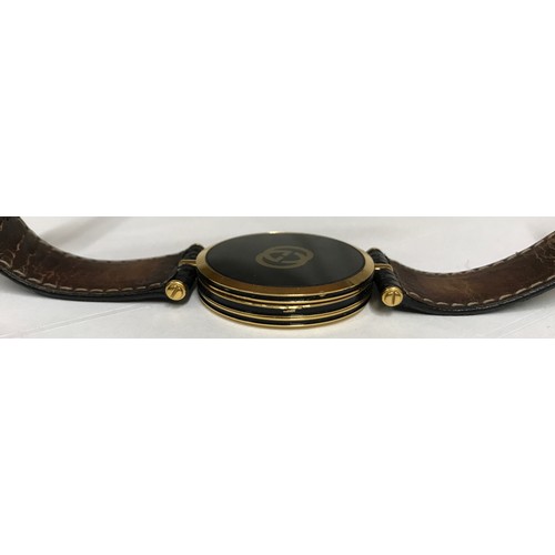 636 - A Gentleman's Gucci gold plated wristwatch with Roman numeral face and leather strap. Case size 3.5c... 