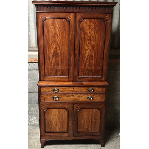 1292 - A Regency mahogany tall cabinet on chest, two door base with fitted drawers interior shelved top. 24... 