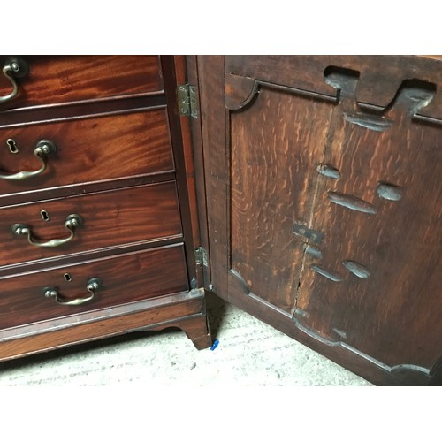 1292 - A Regency mahogany tall cabinet on chest, two door base with fitted drawers interior shelved top. 24... 