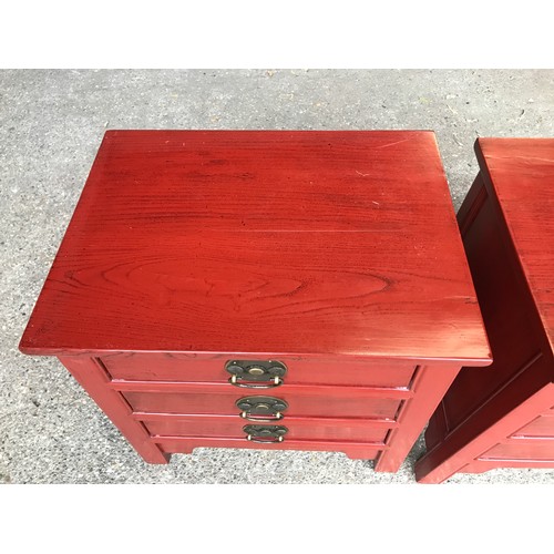 1295 - A pair of Chinese bedside cabinets with three drawers. 52cms w x 39cms d x 61cms h.