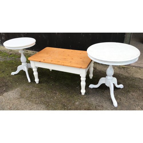 1297 - A pine coffee table with painted base. 91cm w x 55cm d x 46cm h, together with two painted circular ... 