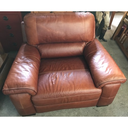 1300 - An Italian made brown leather chunky armchair. Height to seat 48cm, to back approx. 100cm, width 120... 