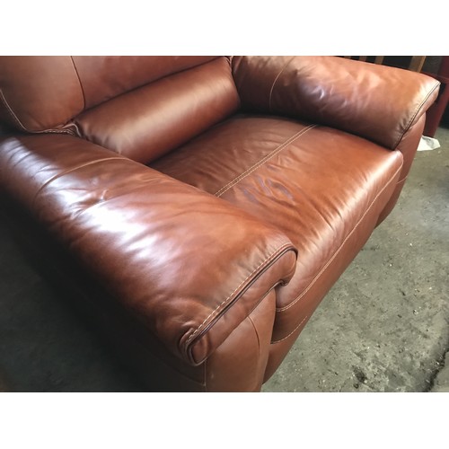 1300 - An Italian made brown leather chunky armchair. Height to seat 48cm, to back approx. 100cm, width 120... 