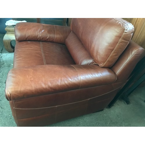 1300 - An Italian made brown leather chunky armchair. Height to seat 48cm, to back approx. 100cm, width 120... 