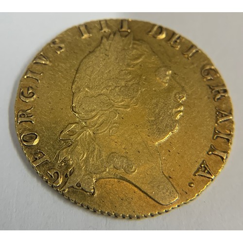 569 - A George III gold 1798 spade guinea. Approx. Weight 8.4gms.