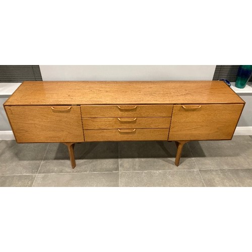 1313 - A mid century teak sideboard retailed by White and Newton Ltd Portsmouth. 198cm w x 76cm h x 43cm d.