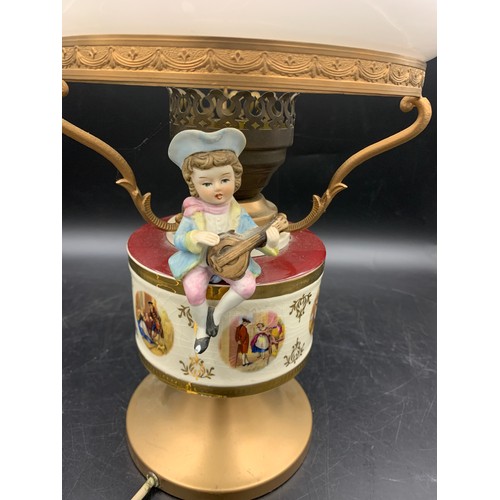 543 - A vintage ceramic and glass table lamp with bisque figure.