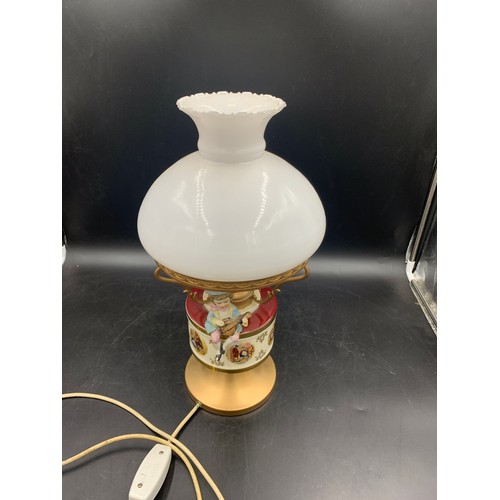 543 - A vintage ceramic and glass table lamp with bisque figure.