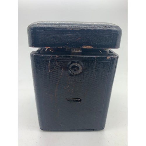 655A - A brass cased carriage clock with repeater mechanism. 13cms h in leather protective case.