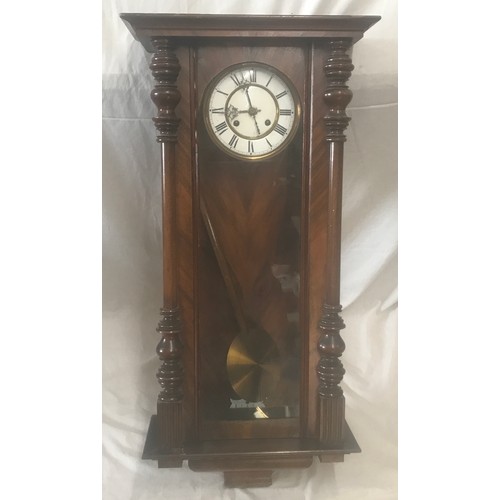 656A - Walnut cased pendulum wall clock, enamel dial, roman numerals. 94 h x 41 w x 18cms d.