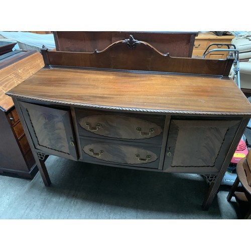 1197A - A mahogany sideboard. 2 doors and drawers to centre, rope twist edge and up stand to back. Fitted bo... 