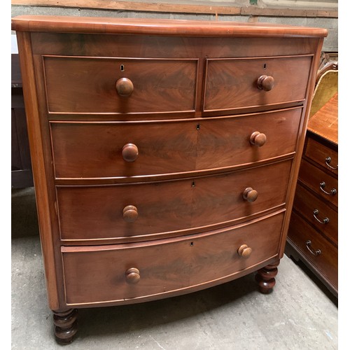 1197B - A Victorian bowfront chest of drawers. 2 short over 3 long drawers on turned legs. 108 w x 54 d x 12... 