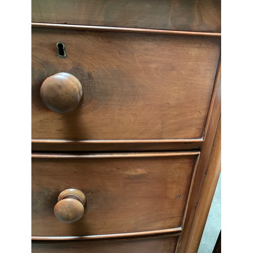 1197B - A Victorian bowfront chest of drawers. 2 short over 3 long drawers on turned legs. 108 w x 54 d x 12... 