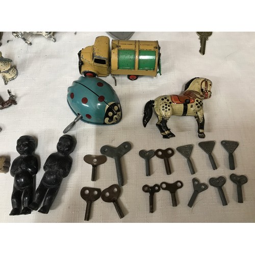 489 - Chad Valley tin plate wind up Ladybird bug with key together with a tin plate wind up horse and 14 w... 