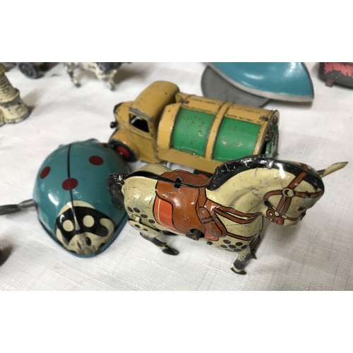 489 - Chad Valley tin plate wind up Ladybird bug with key together with a tin plate wind up horse and 14 w... 