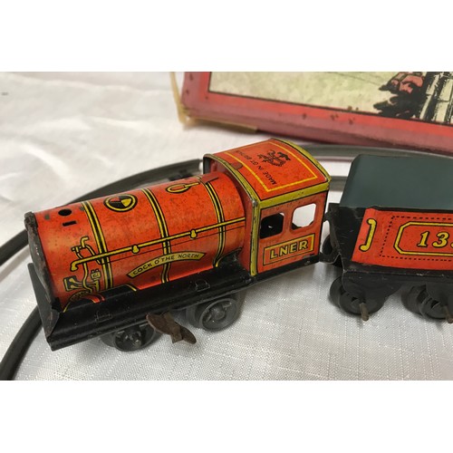 491 - Brimtoys tin plate train set, no. 321'Cock o the North' LNER with track and box, working mechanism.